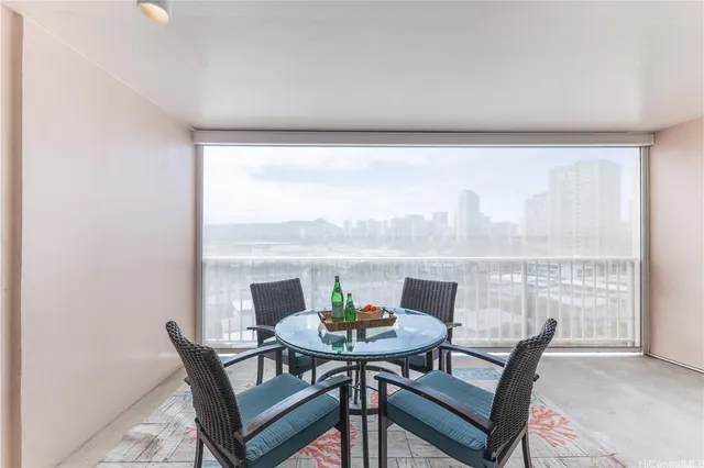 a view of a dining room with furniture and window