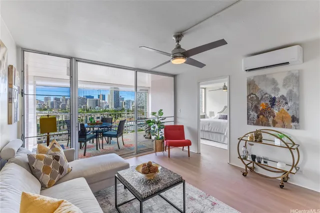 a living room with furniture a rug and a large window