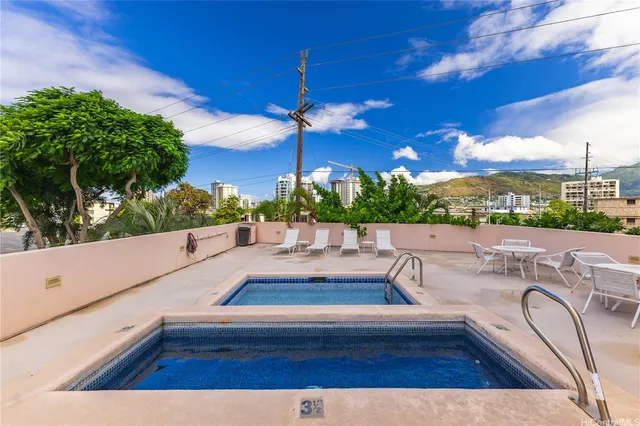 a view of swimming pool with seating