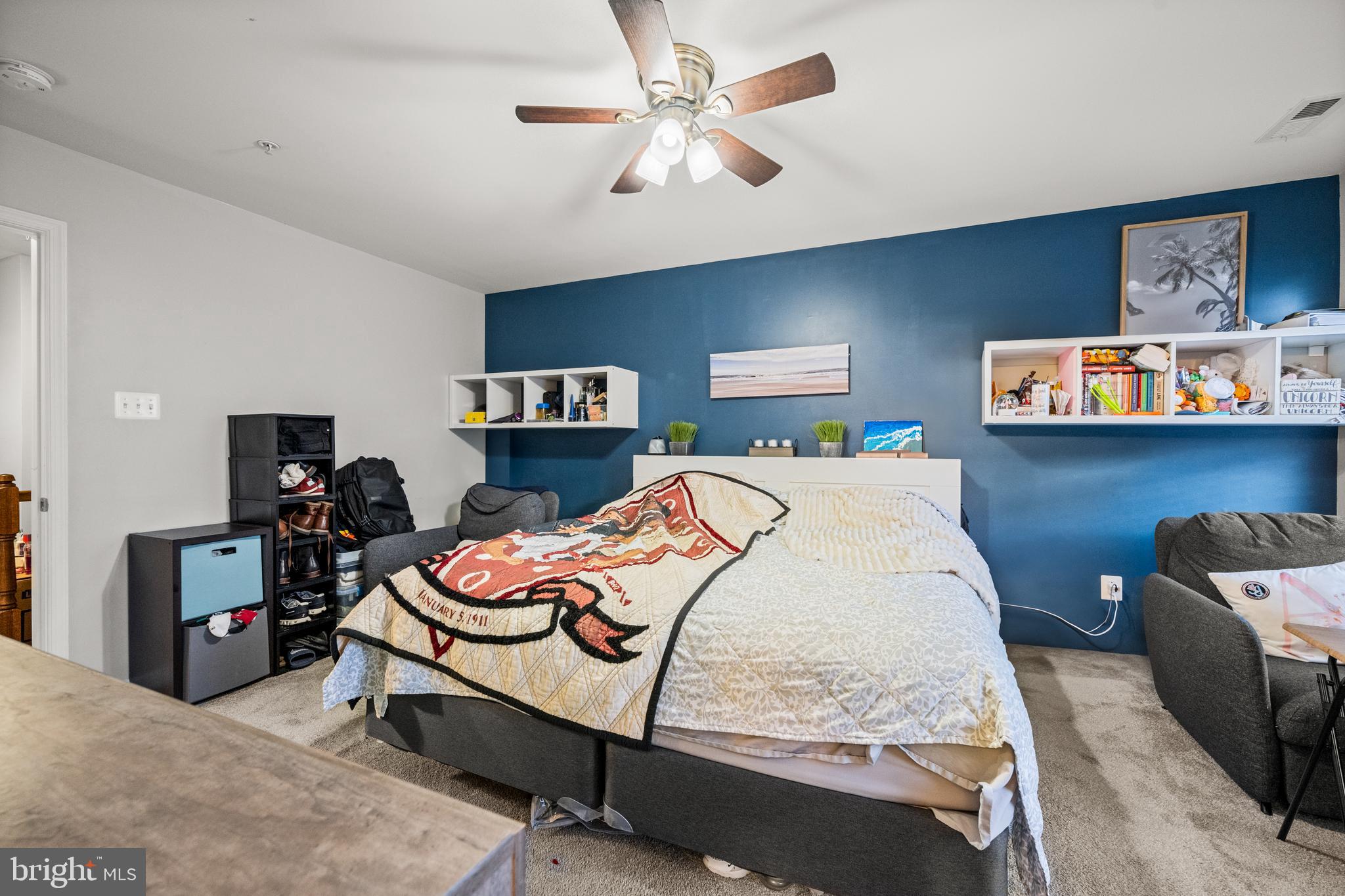 8020 Wright Place Shady Side, MD 20764 - Photo 13 of 21 a bedroom with a bed and wooden floor