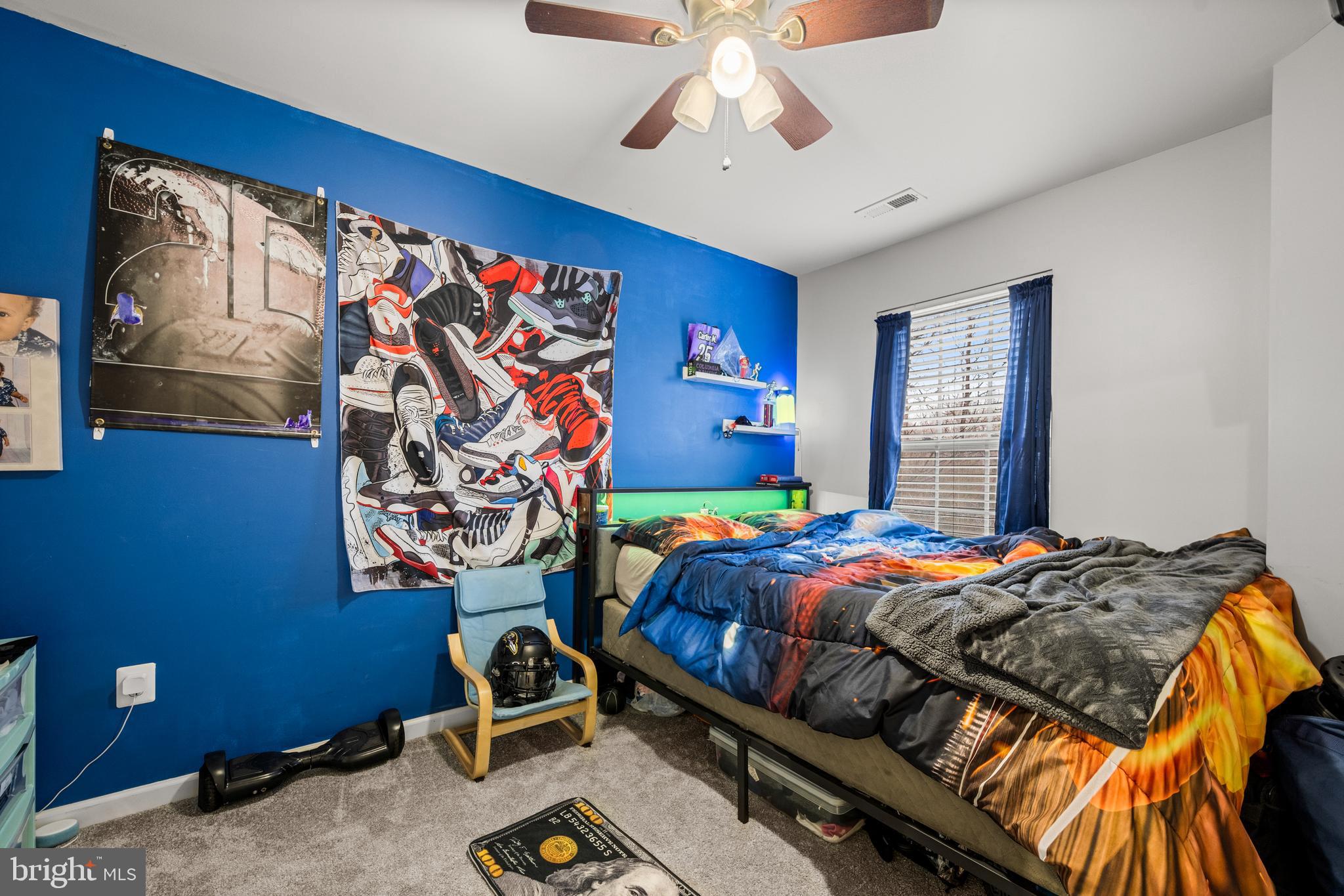 8020 Wright Place Shady Side, MD 20764 - Photo 14 of 21 a bedroom with a bed and a window