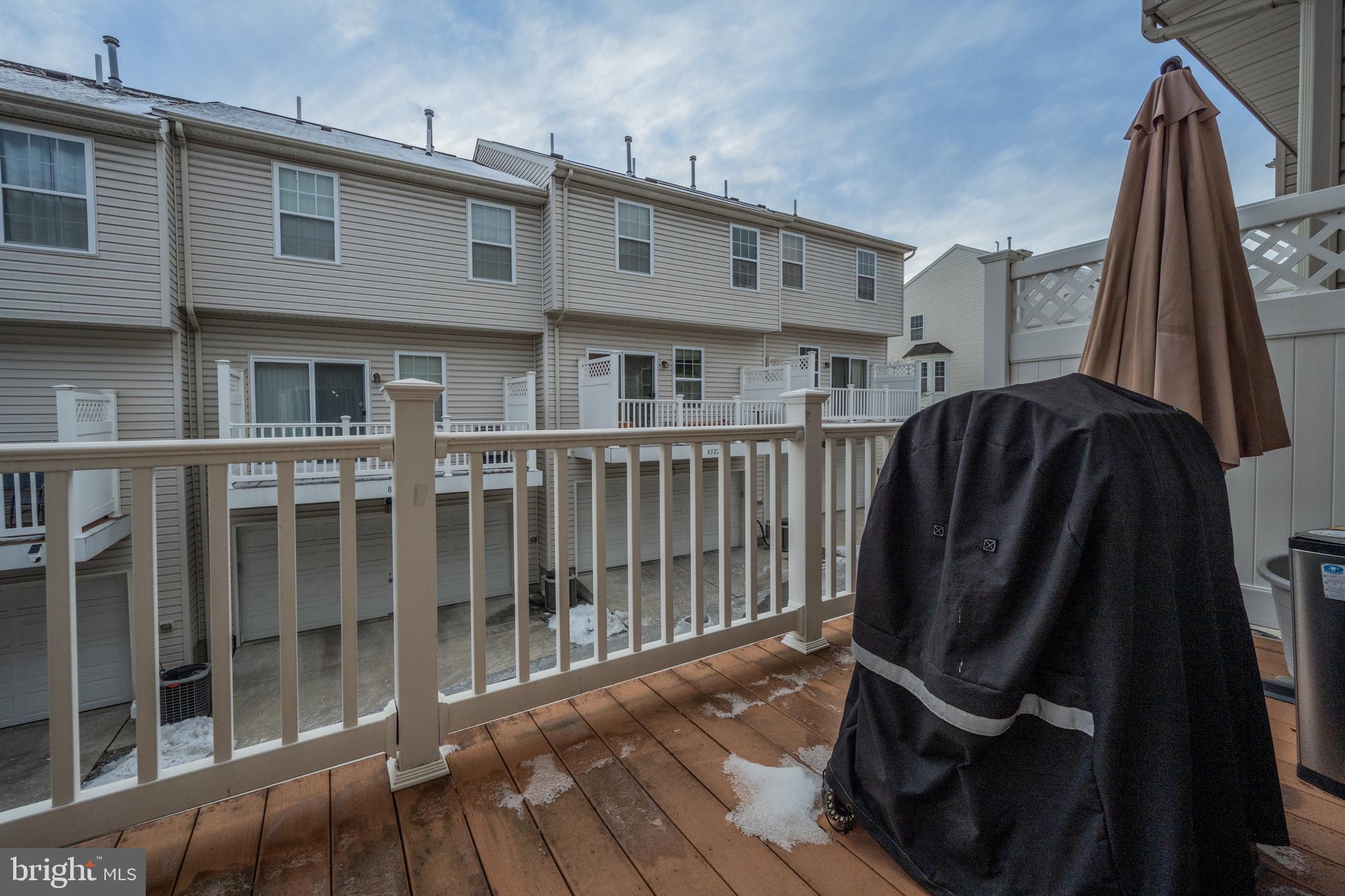 8020 Wright Place Shady Side, MD 20764 - Photo 19 of 21 a view of a house with wooden deck