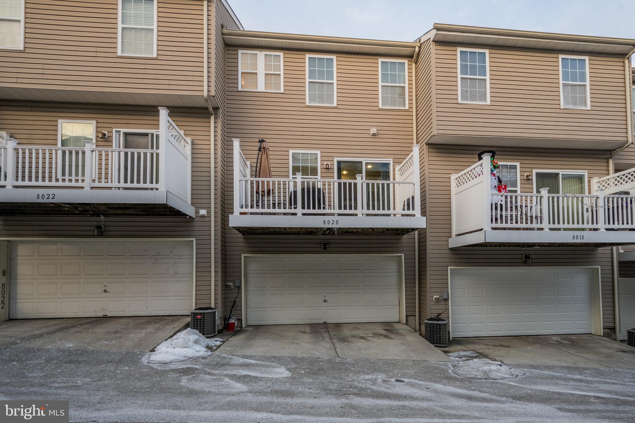 8020 Wright Place Shady Side, MD 20764 - Photo 20 of 21 a front view of a house with a garage