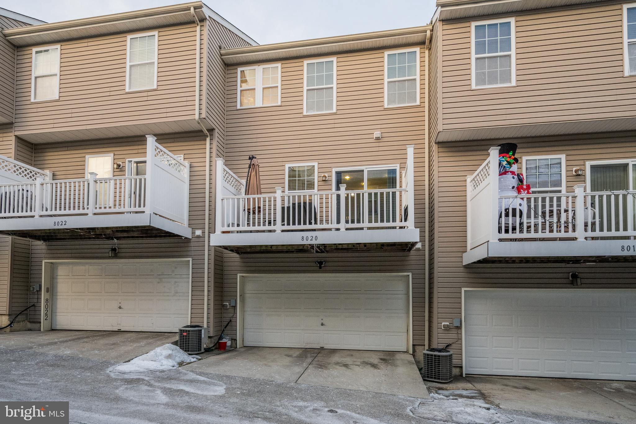 8020 Wright Place Shady Side, MD 20764 - Photo 21 of 21 a front view of a house with a garage
