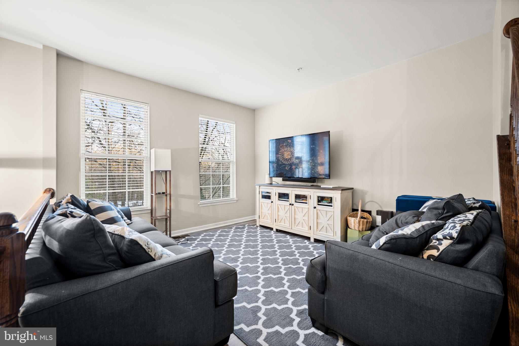 8020 Wright Place Shady Side, MD 20764 - Photo 4 of 21 a living room with furniture and a flat screen tv