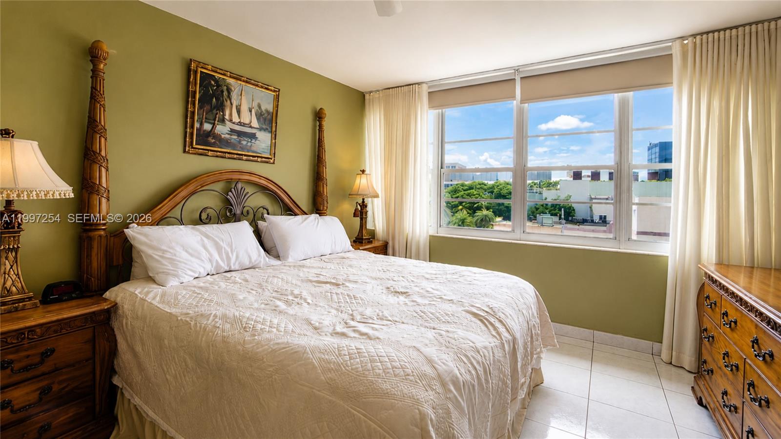 100 Lincoln Road, Unit 422 Miami Beach, FL 33139 - Photo 7 of 23 a bedroom with a large bed and a window