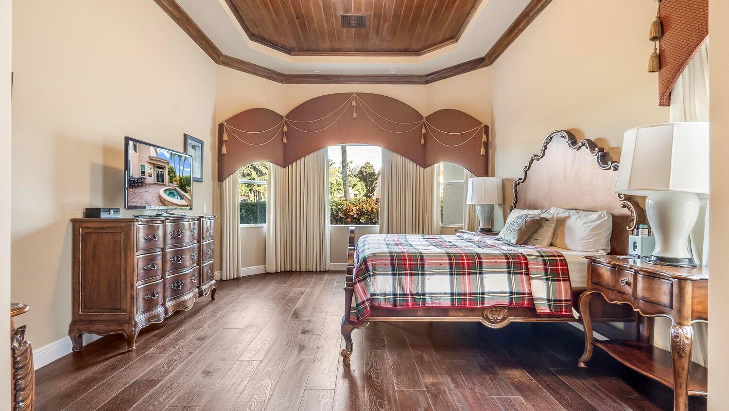 17384 Vistancia Circle Boca Raton, FL 33496 - Photo 13 of 27 a bedroom with bed and a large window