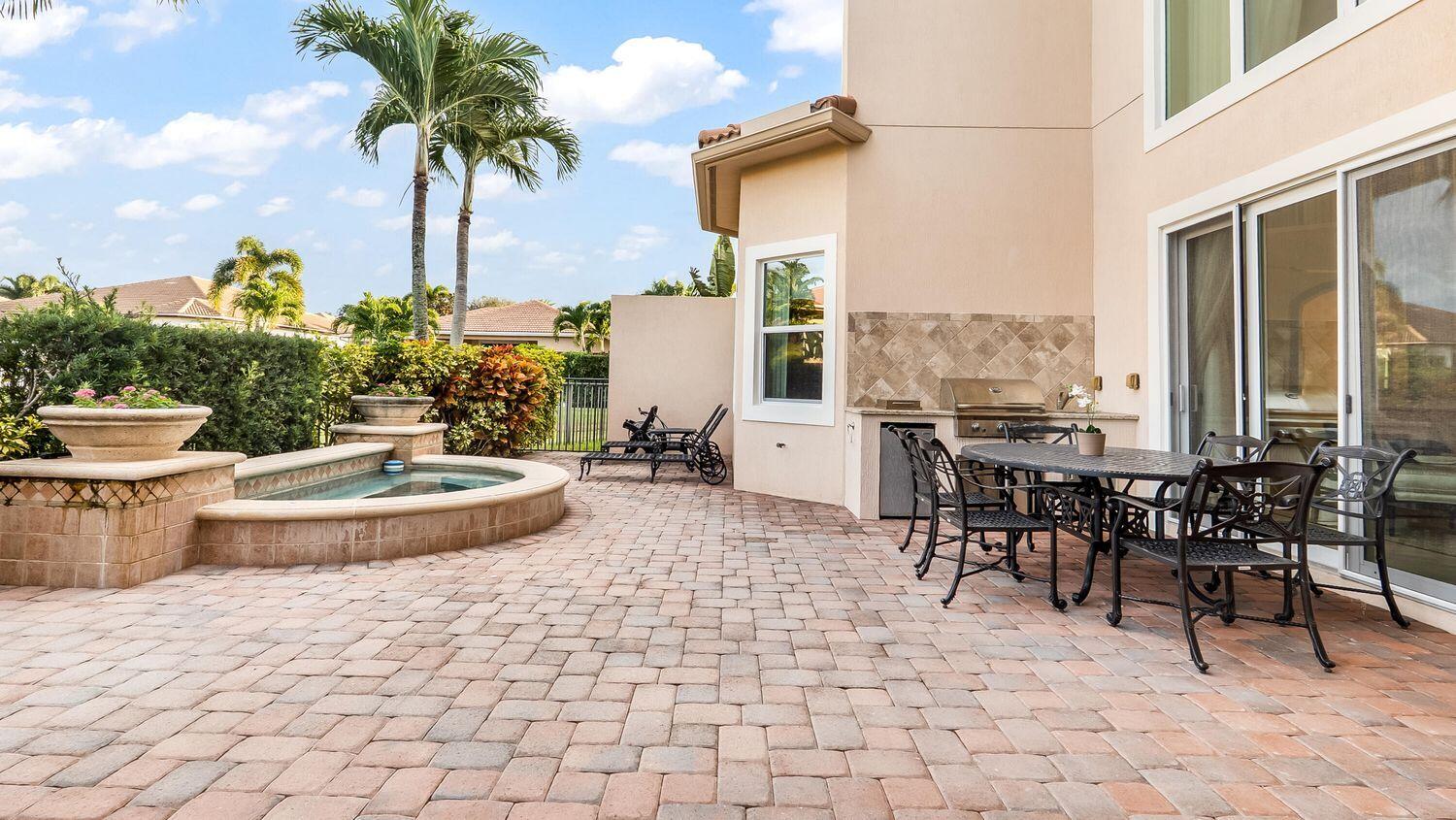 17384 Vistancia Circle Boca Raton, FL 33496 - Photo 21 of 27 a view of a patio with a table and chairs