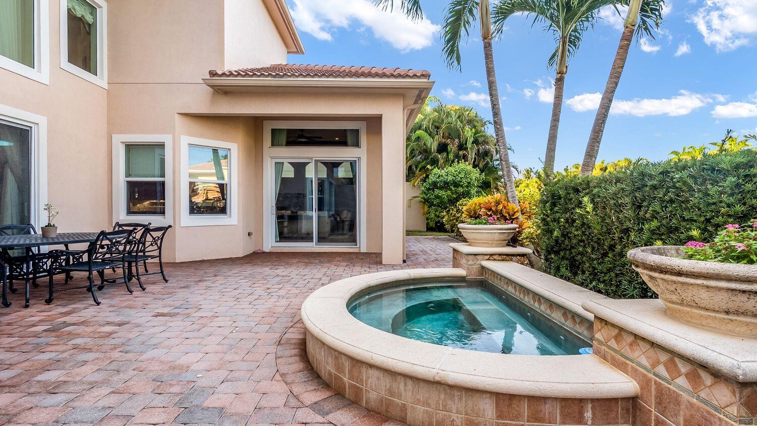 17384 Vistancia Circle Boca Raton, FL 33496 - Photo 22 of 27 a view of a house with sitting area and garden