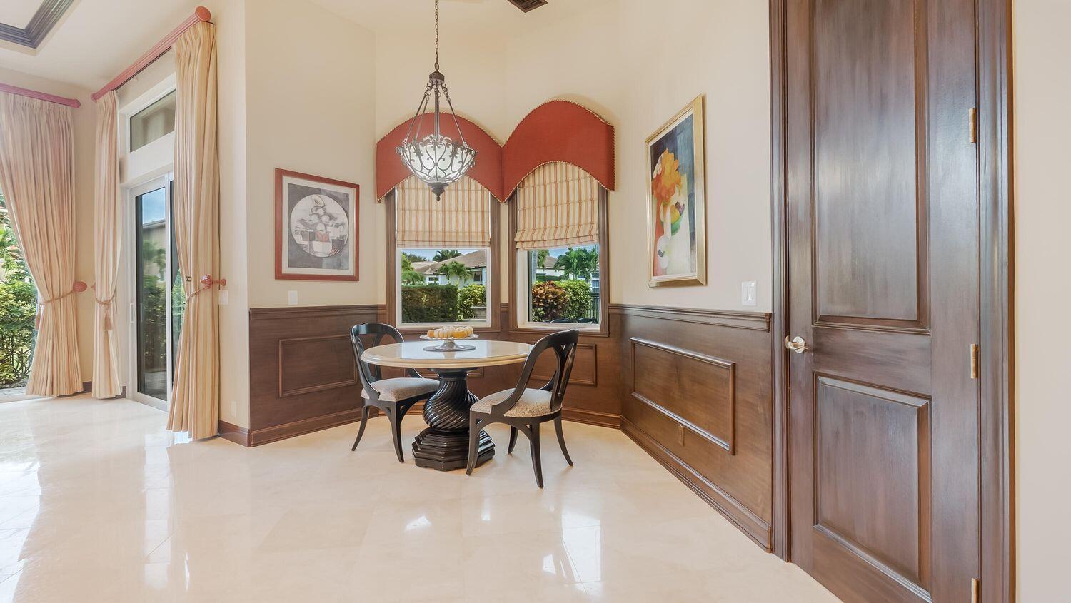 17384 Vistancia Circle Boca Raton, FL 33496 - Photo 9 of 27 a view of a dining room with furniture window and wooden floor