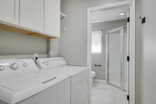 a utility room with dryer and washer