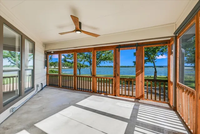 a view of a porch with wooden floor and outdoor space