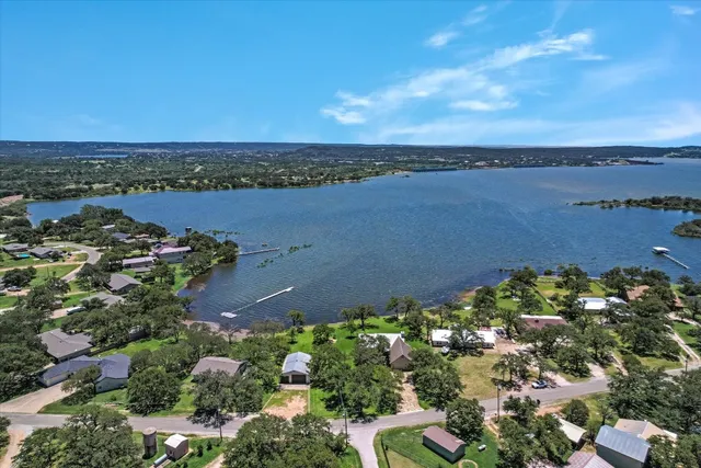 an aerial view of a houses with outdoor space