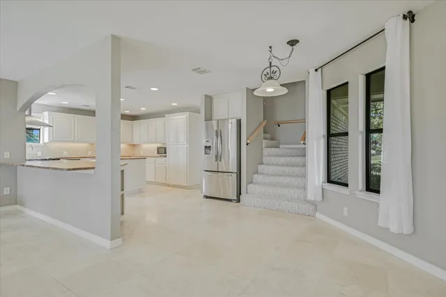 a view of a kitchen with a sink and cabinet area