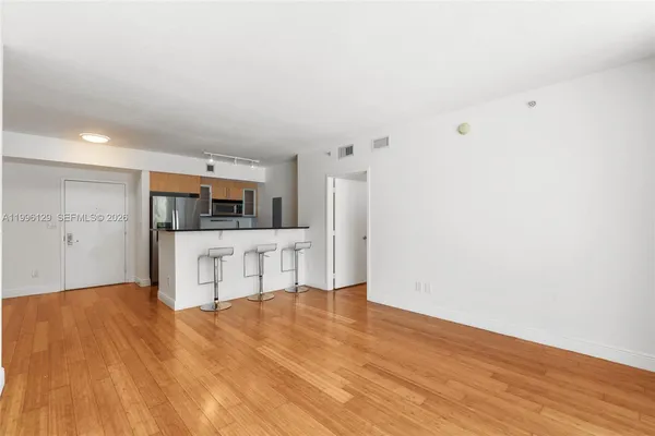 a view of kitchen with wooden floor