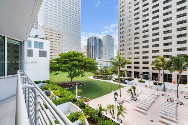 a view of a chair and tables in the patio