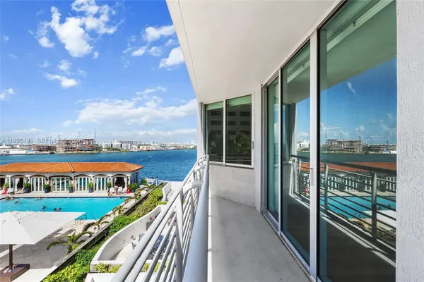 a view of a balcony with an ocean view