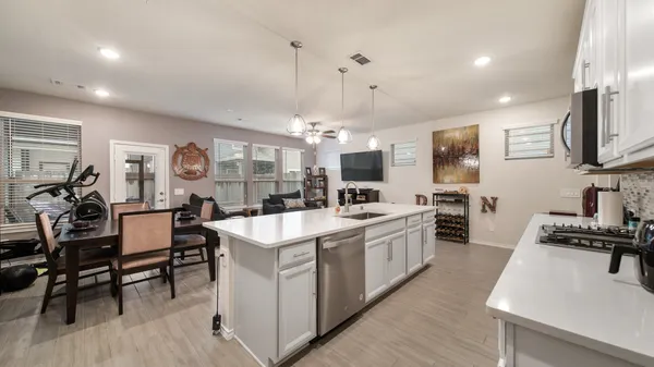 a kitchen with counter top space and appliances