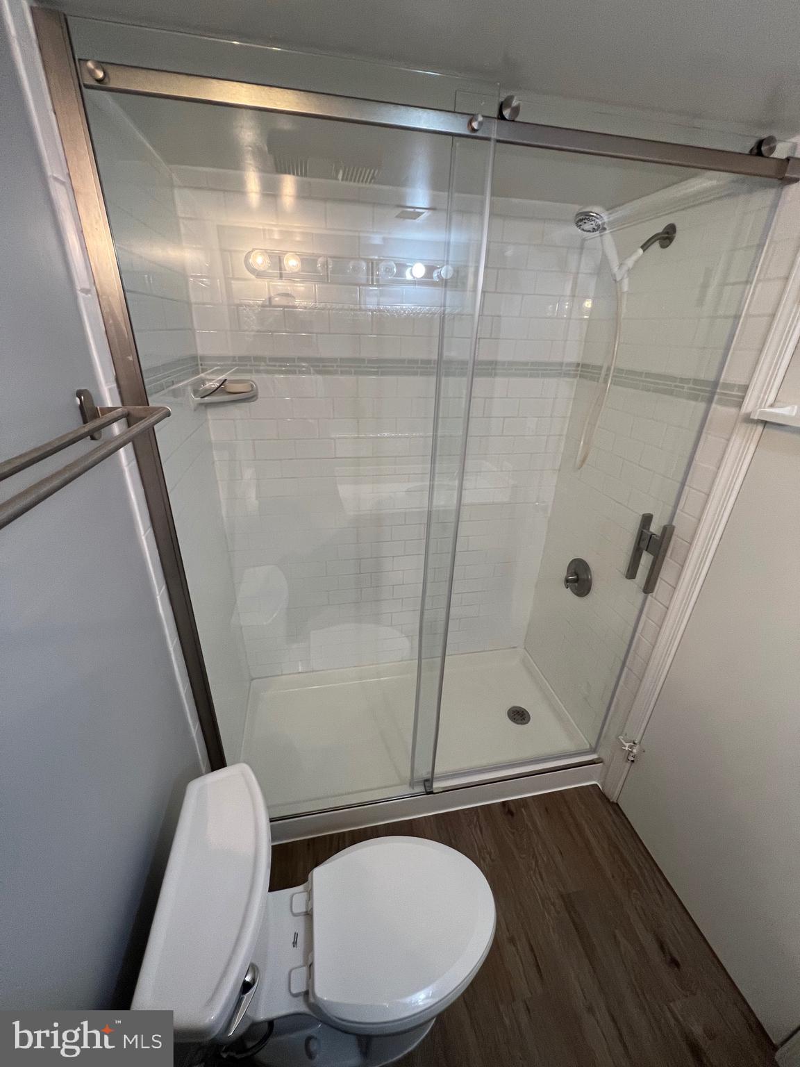 5918 Cove Landing Road, Unit 204 Burke, VA 22015 - Photo 14 of 39 a bathroom with a toilet and a shower