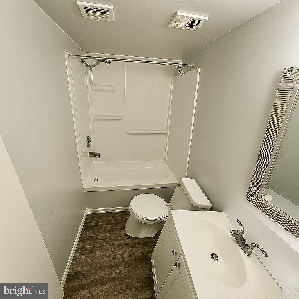 5918 Cove Landing Road, Unit 204 Burke, VA 22015 - Photo 17 of 39 a bathroom with a sink toilet and shower