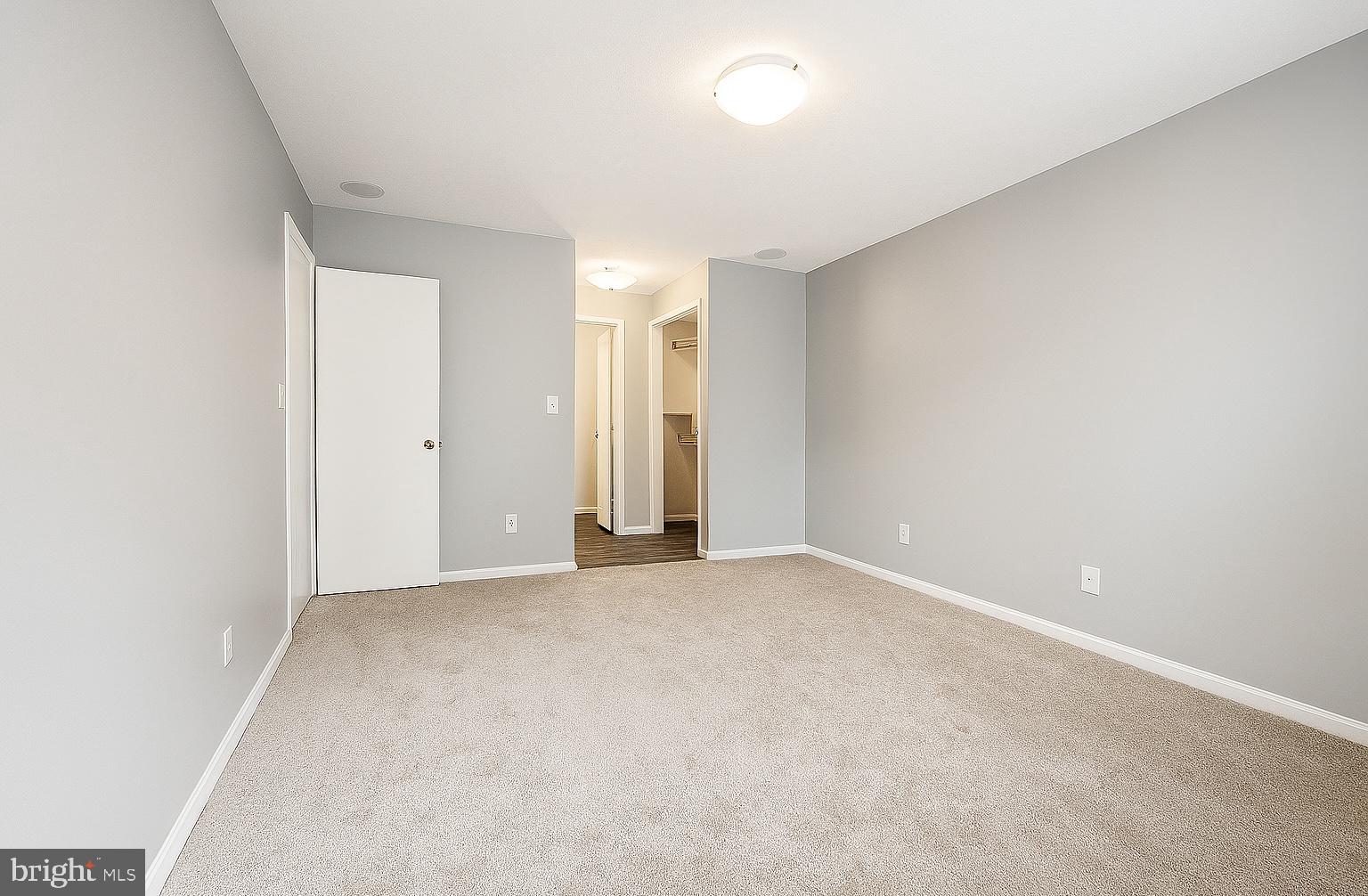 5918 Cove Landing Road, Unit 204 Burke, VA 22015 - Photo 20 of 39 an empty room with an entryway
