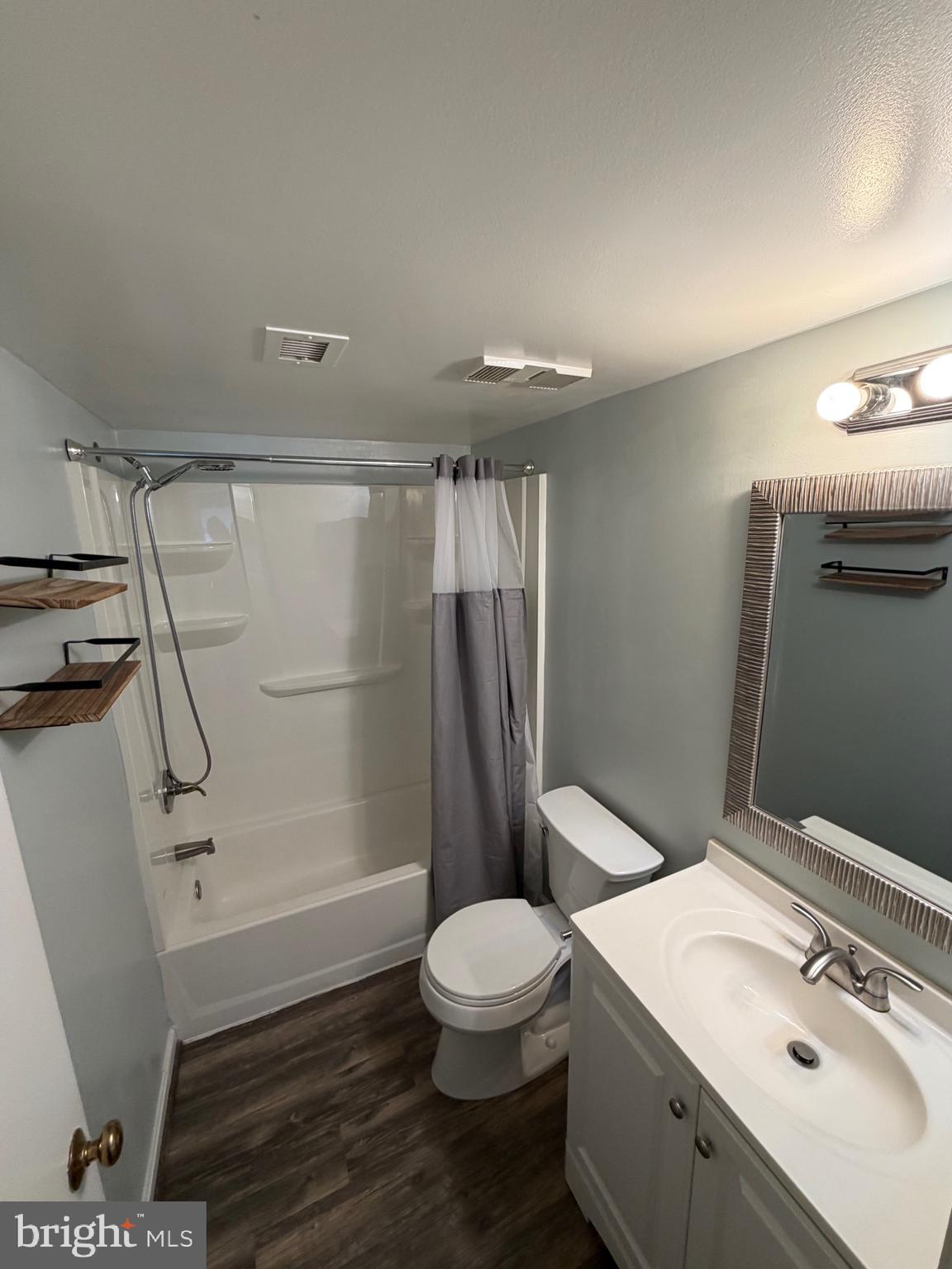 5918 Cove Landing Road, Unit 204 Burke, VA 22015 - Photo 41 of 50 a bathroom with a sink a toilet and shower