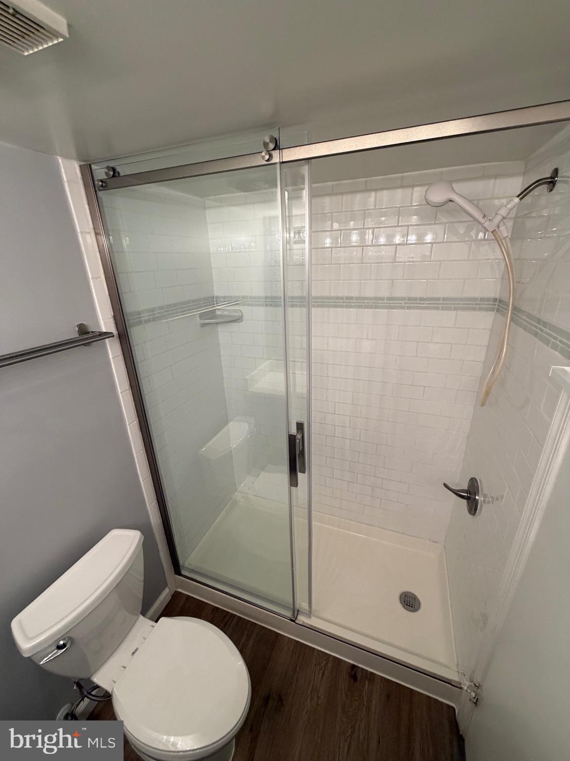 5918 Cove Landing Road, Unit 204 Burke, VA 22015 - Photo 45 of 50 a bathroom with a toilet and a shower