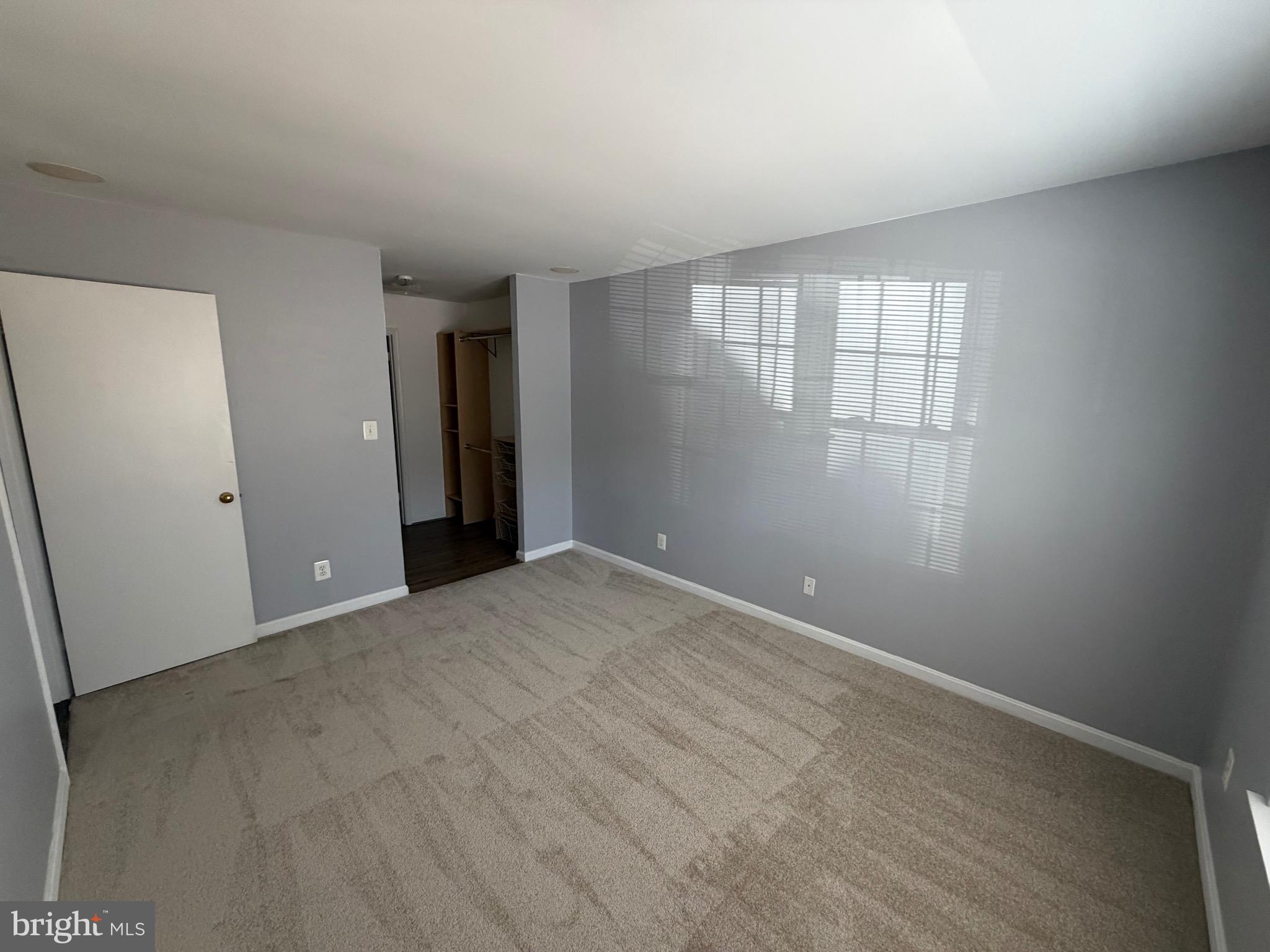 5918 Cove Landing Road, Unit 204 Burke, VA 22015 - Photo 49 of 50 an empty room with windows and closet