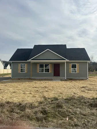 a front view of a house with yard
