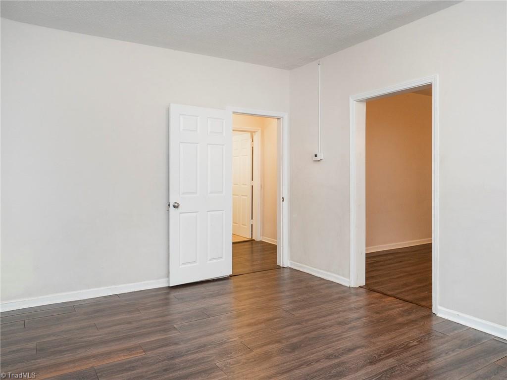 1009 Forrest Street High Point, NC 27262 - Photo 11 of 27 View of dining room leading to bedrooms and living room.