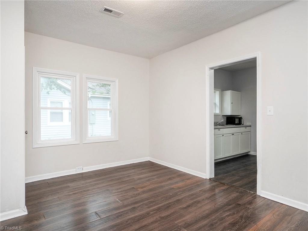 1009 Forrest Street High Point, NC 27262 - Photo 12 of 27 View of dining room leading to kitchen.