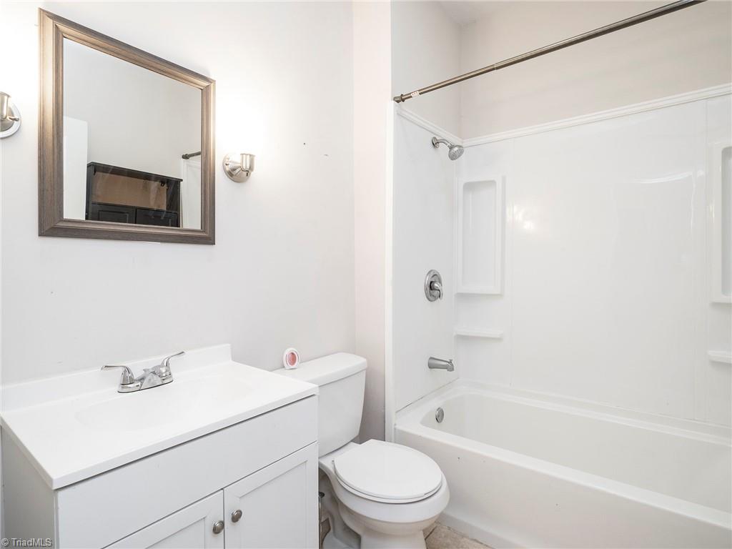 1009 Forrest Street High Point, NC 27262 - Photo 17 of 27 Hall bath with shower/tub combo and single bowl vanity.