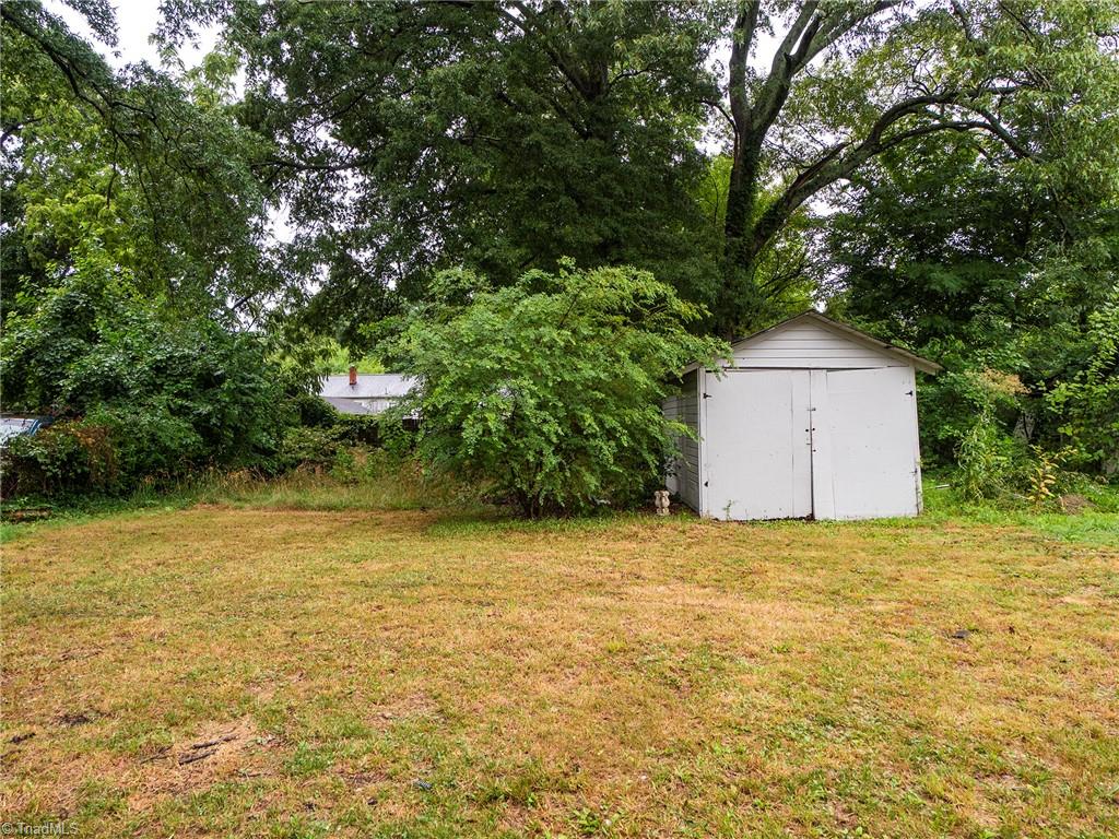 1009 Forrest Street High Point, NC 27262 - Photo 22 of 27 Flat backyard with storage building.