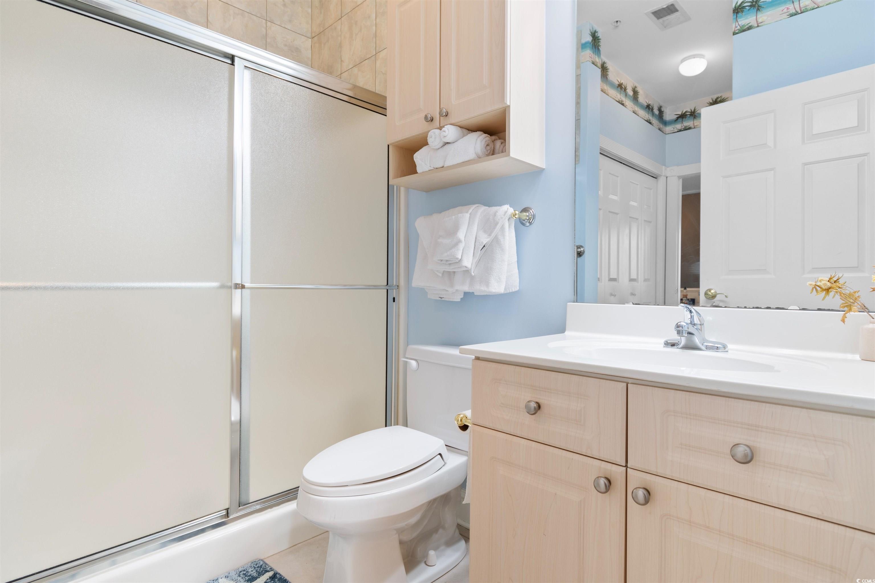 4891 Luster Leaf Circle, Unit 401 Myrtle Beach, SC 29577 - Photo 19 of 35 Bathroom featuring vanity, a shower stall, and tile patterned floors