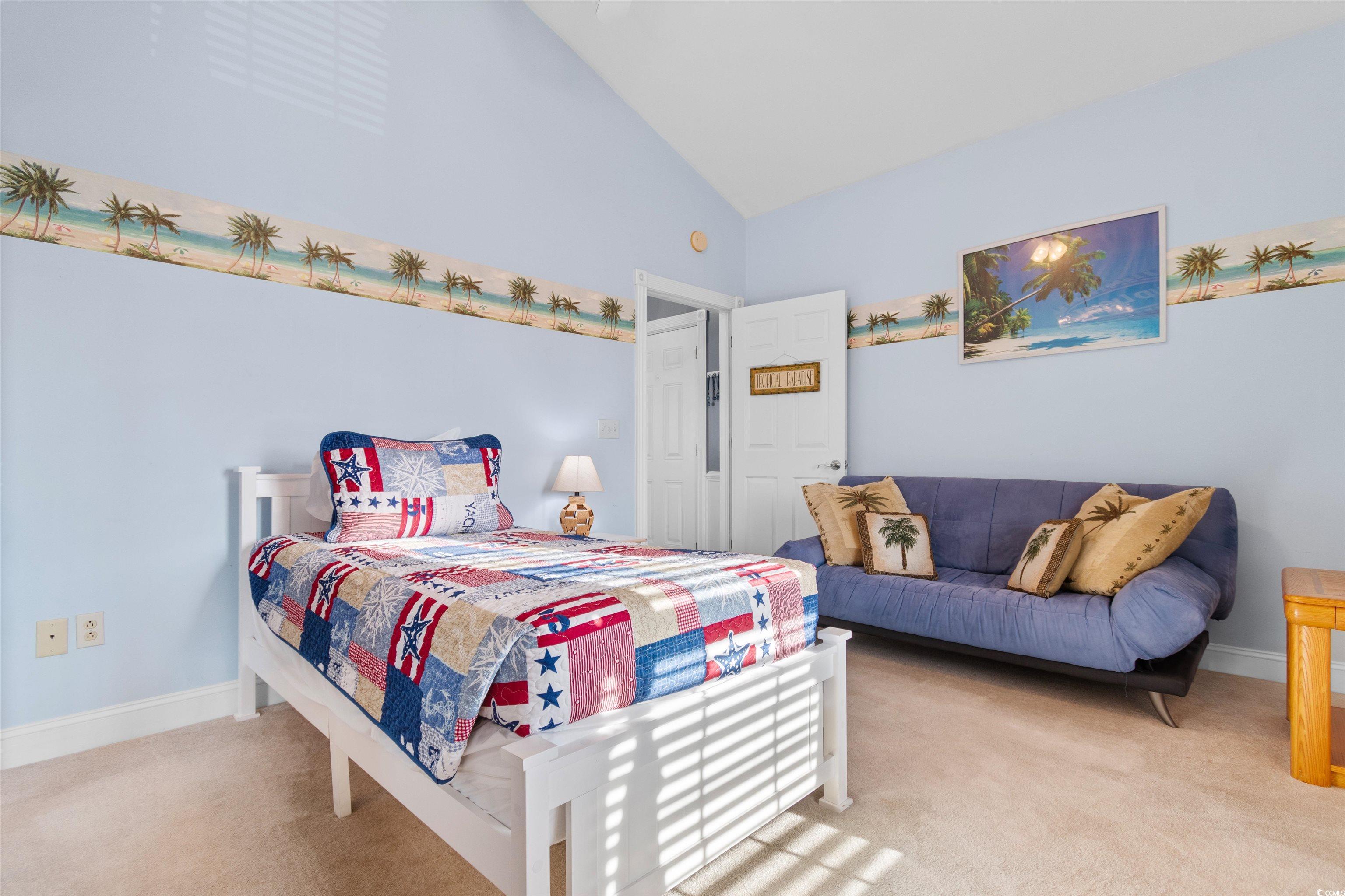 4891 Luster Leaf Circle, Unit 401 Myrtle Beach, SC 29577 - Photo 22 of 35 Bedroom featuring carpet floors and lofted ceiling