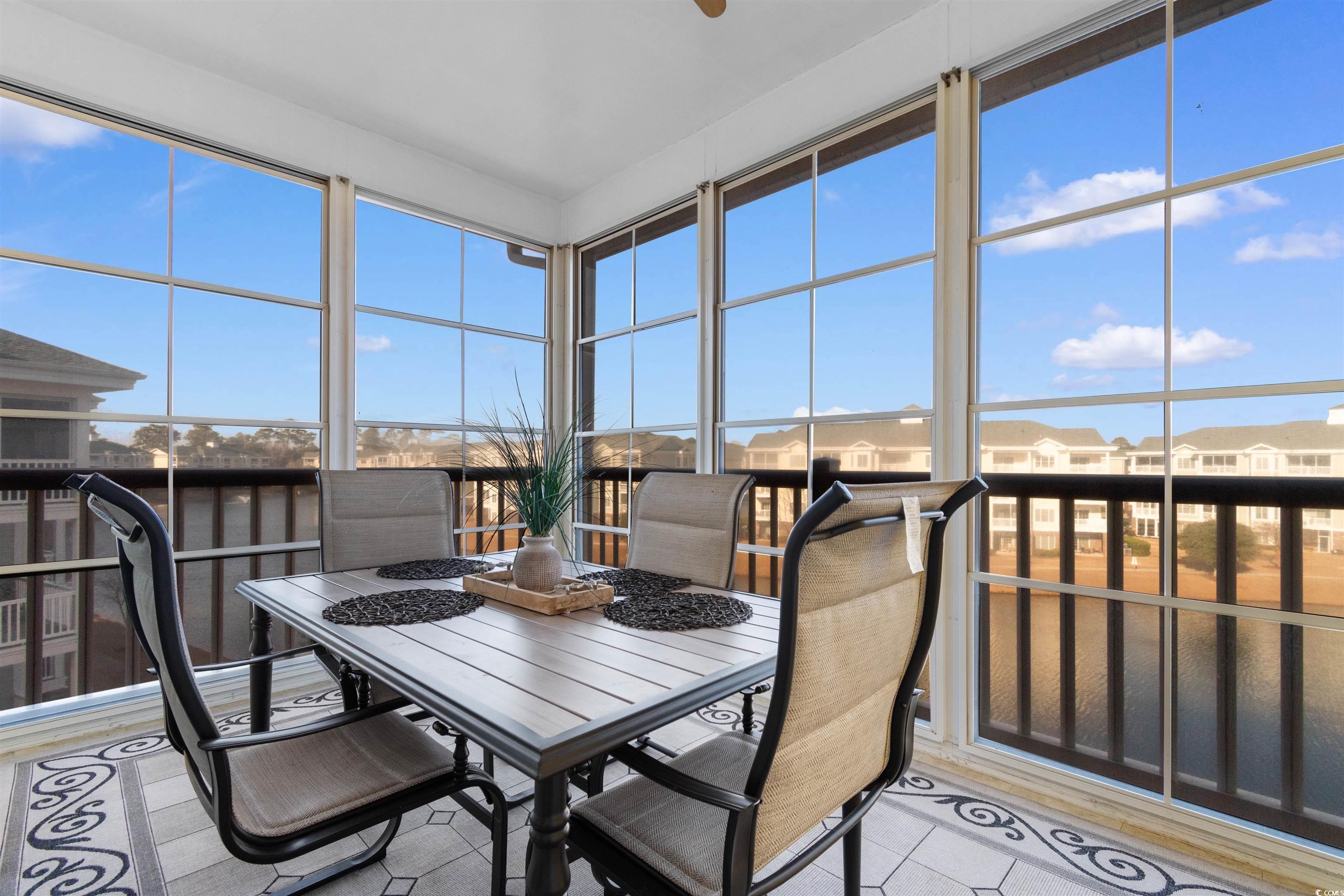 4891 Luster Leaf Circle, Unit 401 Myrtle Beach, SC 29577 - Photo 26 of 35 Sunroom / solarium featuring a residential view