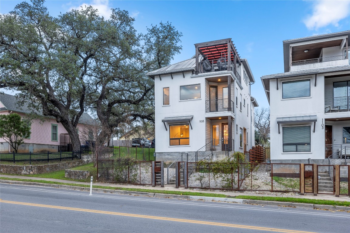 1105 East 12th Street Austin, TX 78702 - Photo 2 of 28 a front view of residential houses with street