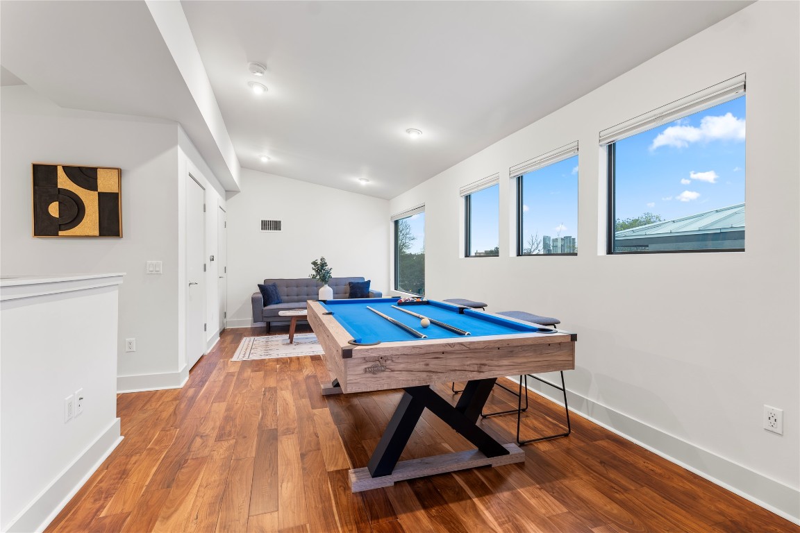 1105 East 12th Street Austin, TX 78702 - Photo 23 of 28 a room with furniture and wooden floor