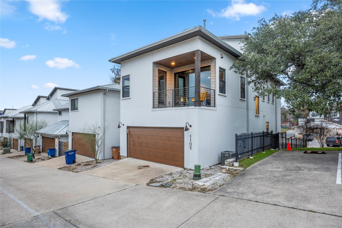 1105 East 12th Street Austin, TX 78702 - Photo 25 of 28 a front view of a house with a yard