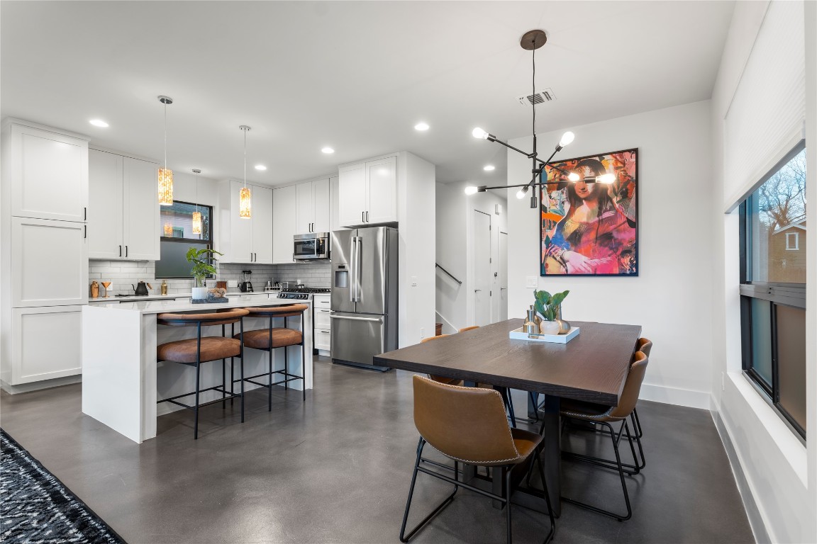 1105 East 12th Street Austin, TX 78702 - Photo 3 of 28 a view of a dining room with furniture and wooden floor