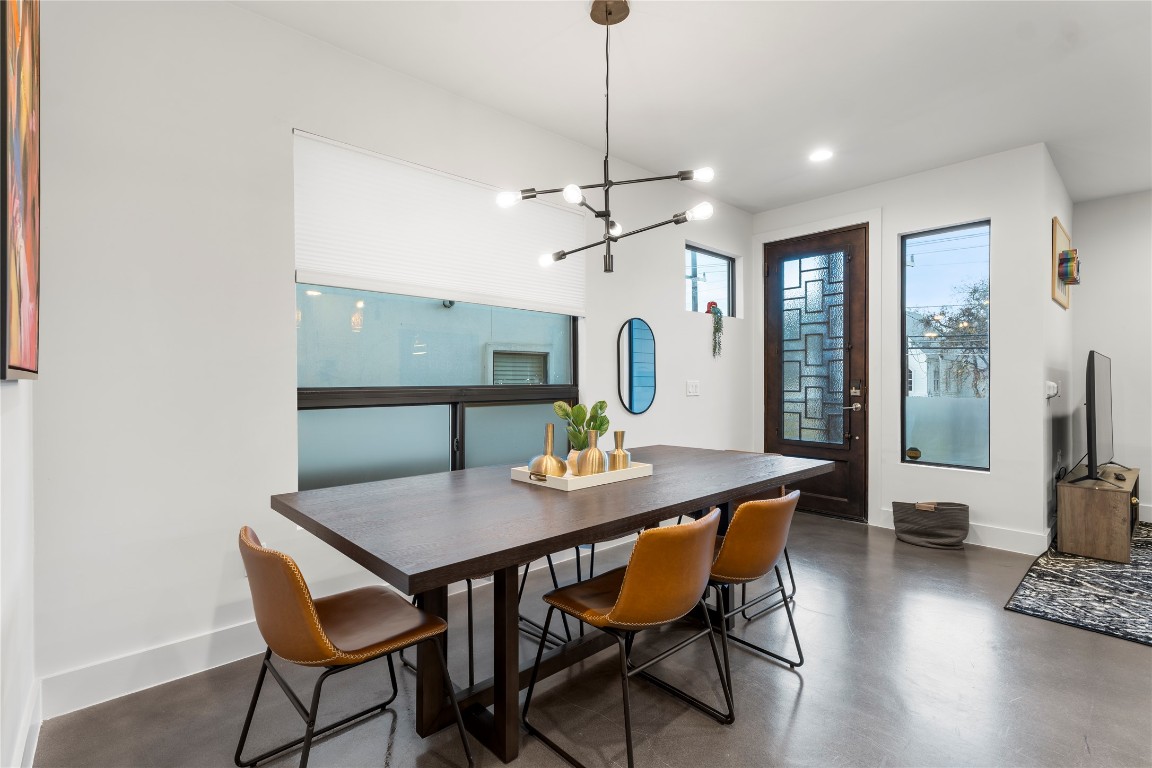 1105 East 12th Street Austin, TX 78702 - Photo 8 of 28 a view of a dining room with furniture window and wooden floor