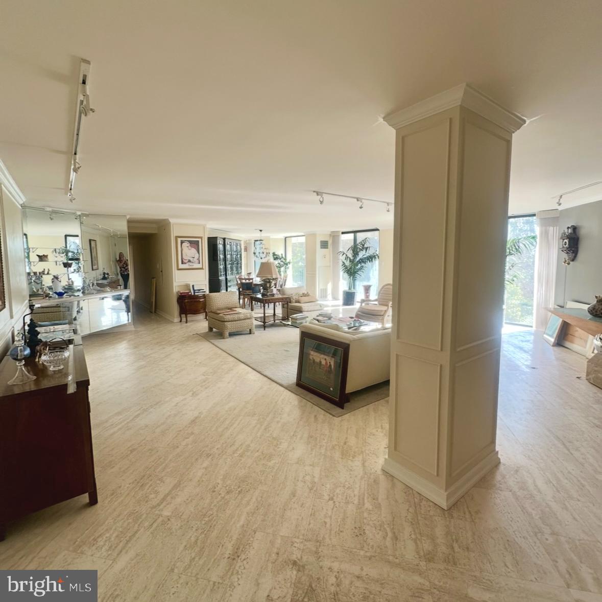 a view of a living room and kitchen area