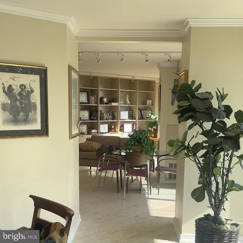 a bathroom with double vanity and a mirror