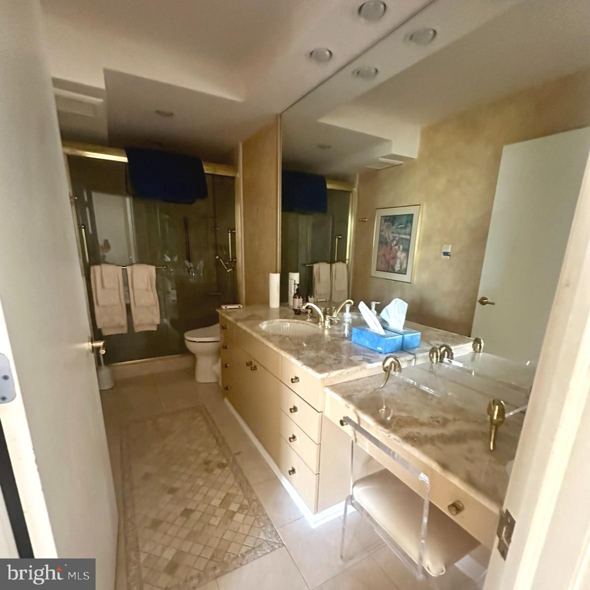 8302 Old York Road, Unit C61 Elkins Park, PA 19027 - Photo 16 of 25 a spacious bathroom with a granite countertop sink and a mirror