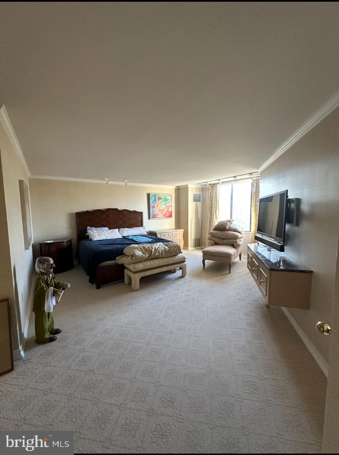 8302 Old York Road, Unit C61 Elkins Park, PA 19027 - Photo 17 of 25 a living room with furniture a flat screen tv and gym equipment
