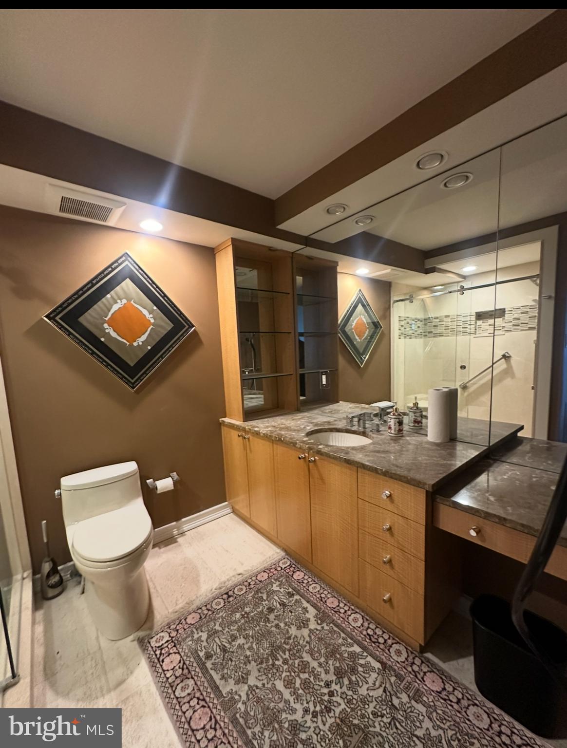 8302 Old York Road, Unit C61 Elkins Park, PA 19027 - Photo 20 of 25 a bathroom with a granite countertop sink a toilet a mirror and bathtub