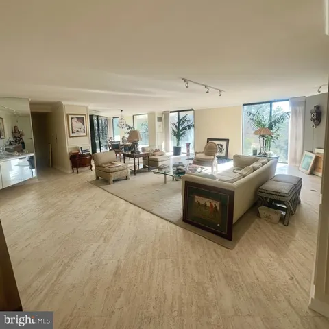 a living room with furniture and a table