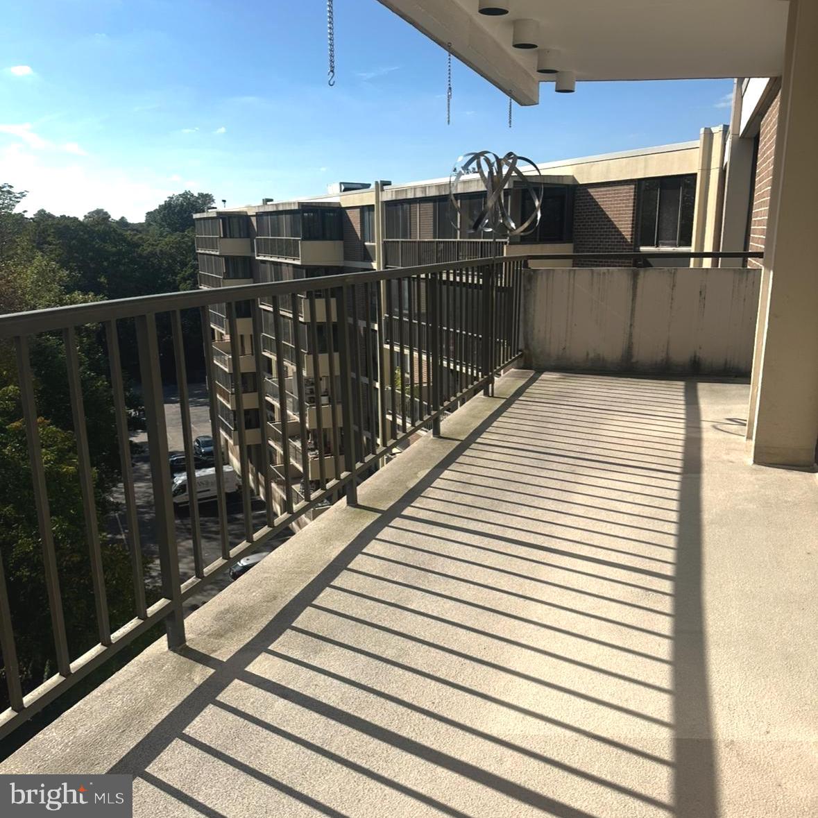 8302 Old York Road, Unit C61 Elkins Park, PA 19027 - Photo 23 of 25 a view of a balcony with wooden floor