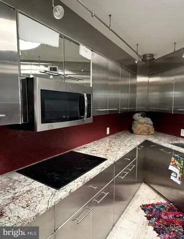 a kitchen with a stove and a microwave