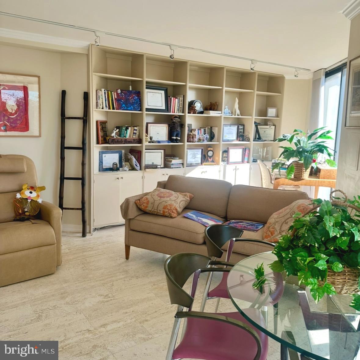 8302 Old York Road, Unit C61 Elkins Park, PA 19027 - Photo 5 of 25 a living room with furniture and a potted plant